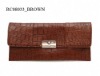 Alligator embossed clutch