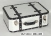 Beautiful and durable travel suitcase with rivets and leather