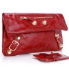 Beautiful red handbag with gold button on it