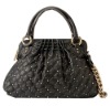 Characteristic ladies handbags with rivets