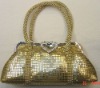 Gold metal mesh handbag with hard handles