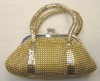 Gold metal mesh handbag with hard handles