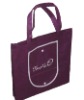 Portable nonwoven shopping bag