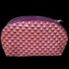 Purple PU cosmetic bag with zippered closure