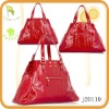 Red patent leather plain tote bag with gold hardware