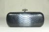 The knot python clutch bag