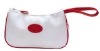 White microfiber make up bag with red self fabric handle and piping