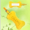 Yellow color bone shaped luggage tag