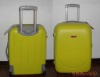 Yellow hard plastic suitcase