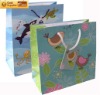 bird paper gift bag ribbon
