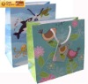 bird paper gift bag ribbon