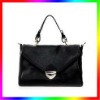 designer black patent leather studded handbag