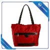 handbag with outside pockets and long shoulder strips