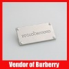 metal tag with company logo