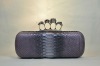 python skin Four Ring skull clutch bag