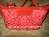 red leather hand bag