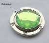table purse hook with green acrylic stone