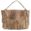 women fashioh handbag outside with tassels